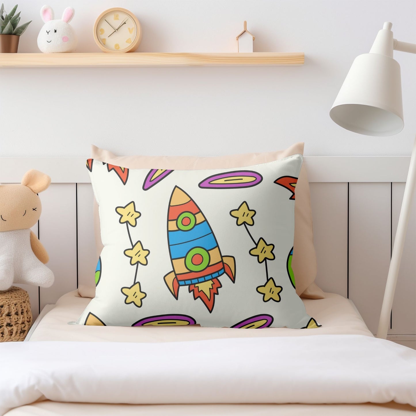 Colorful space-themed pillow designed for imaginative play and relaxation.