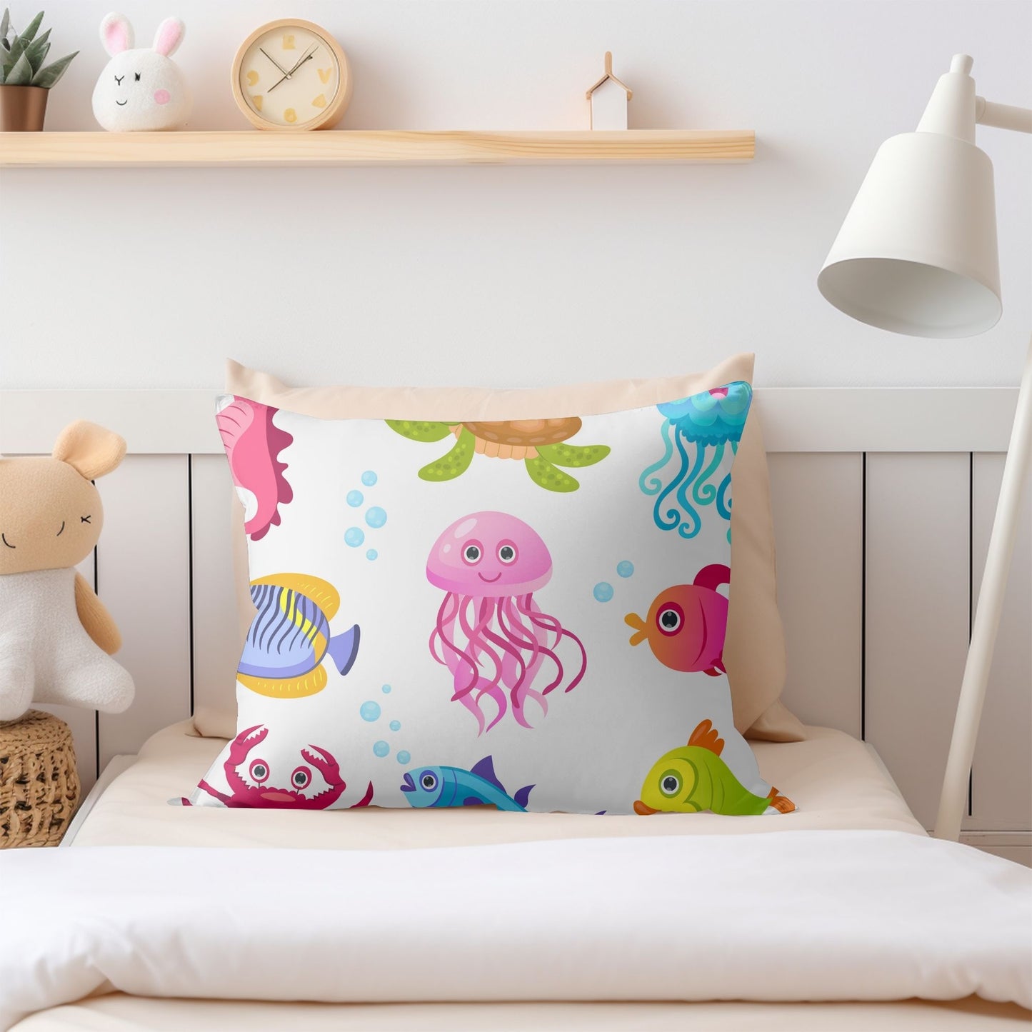 Charming kids pillow with a variety of sea creatures.