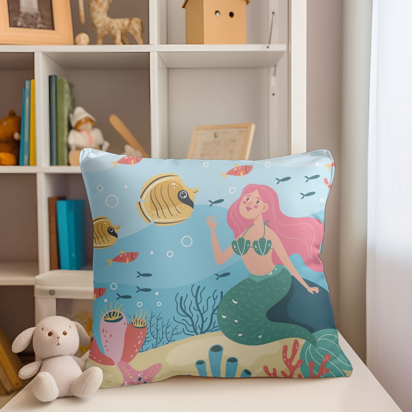 Charming pillow with mermaid print for girls' room decor.