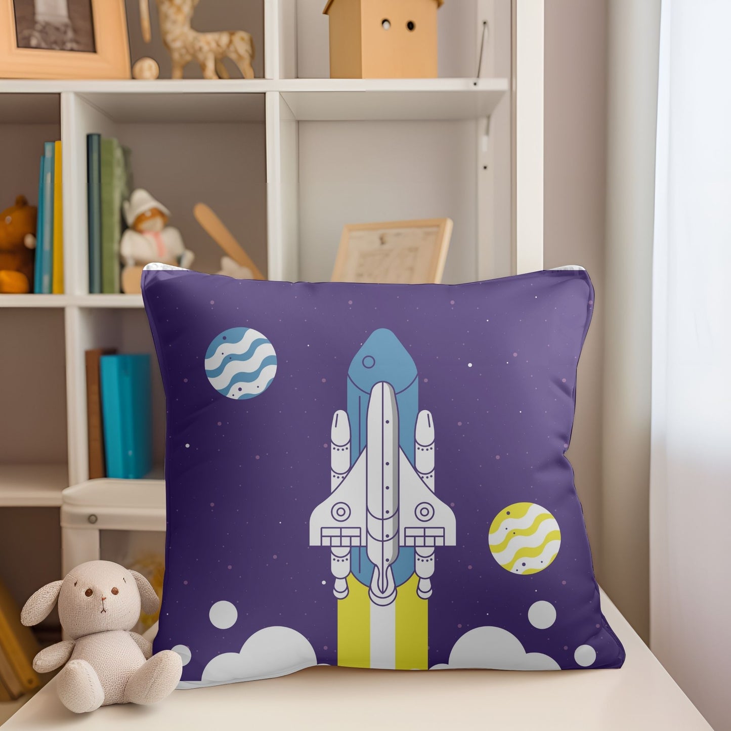 Charming kids pillow adorned with a space rocket in flight for adventurous dreams.