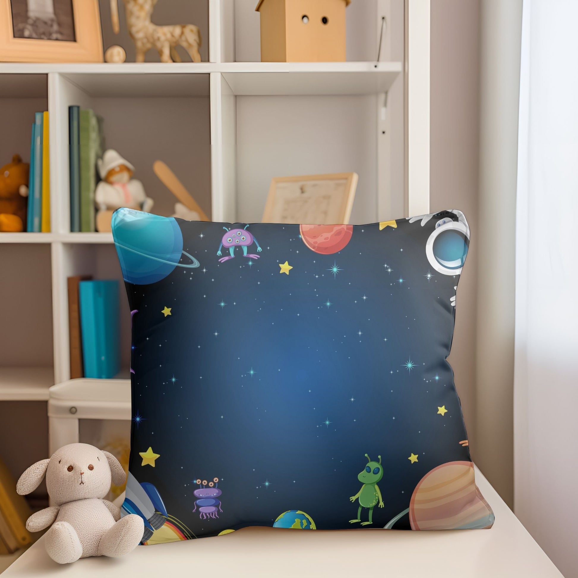 Charming kids pillow adorned with a variety of cute aliens.