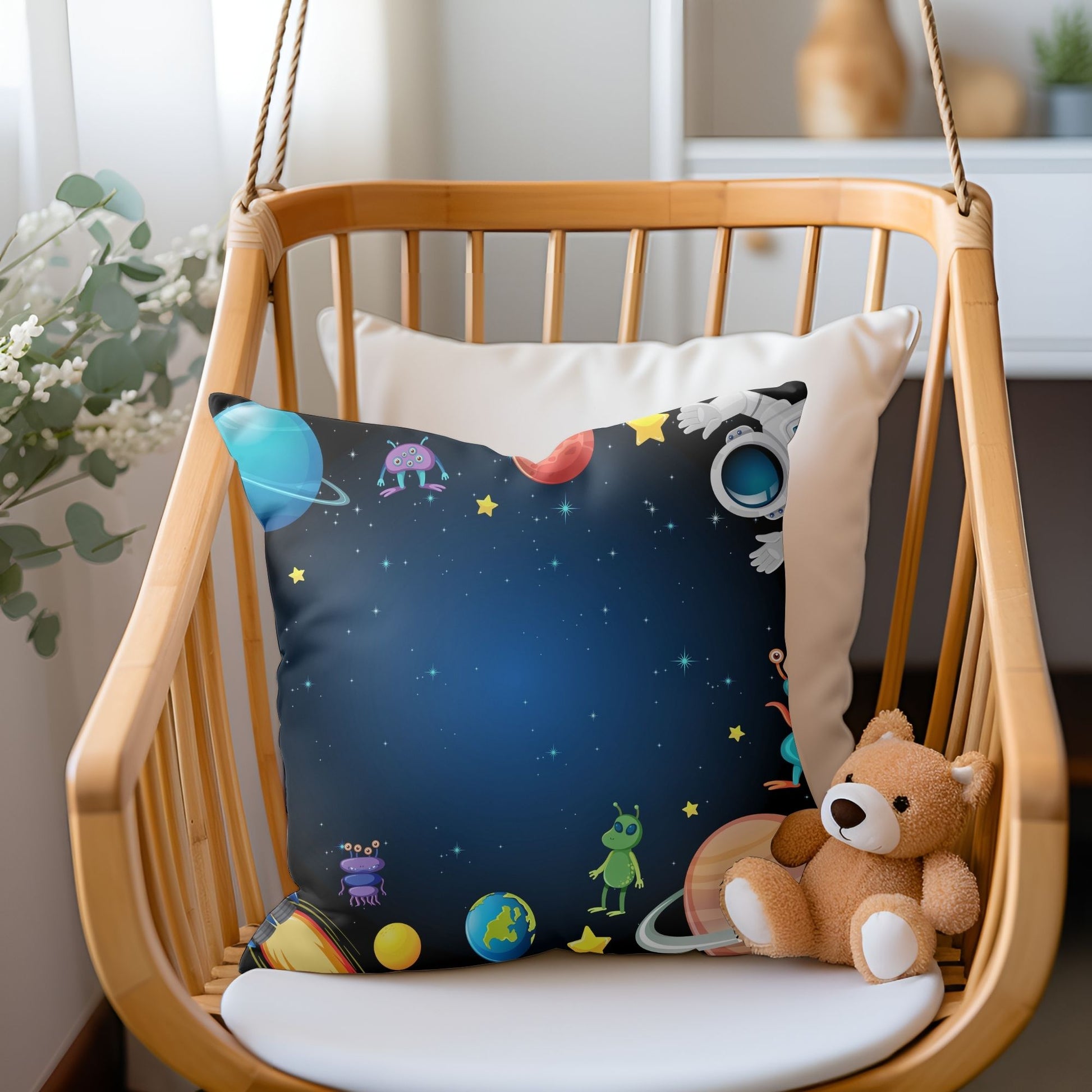 Adorable aliens patterned pillow to add a playful touch to kids' bedrooms.