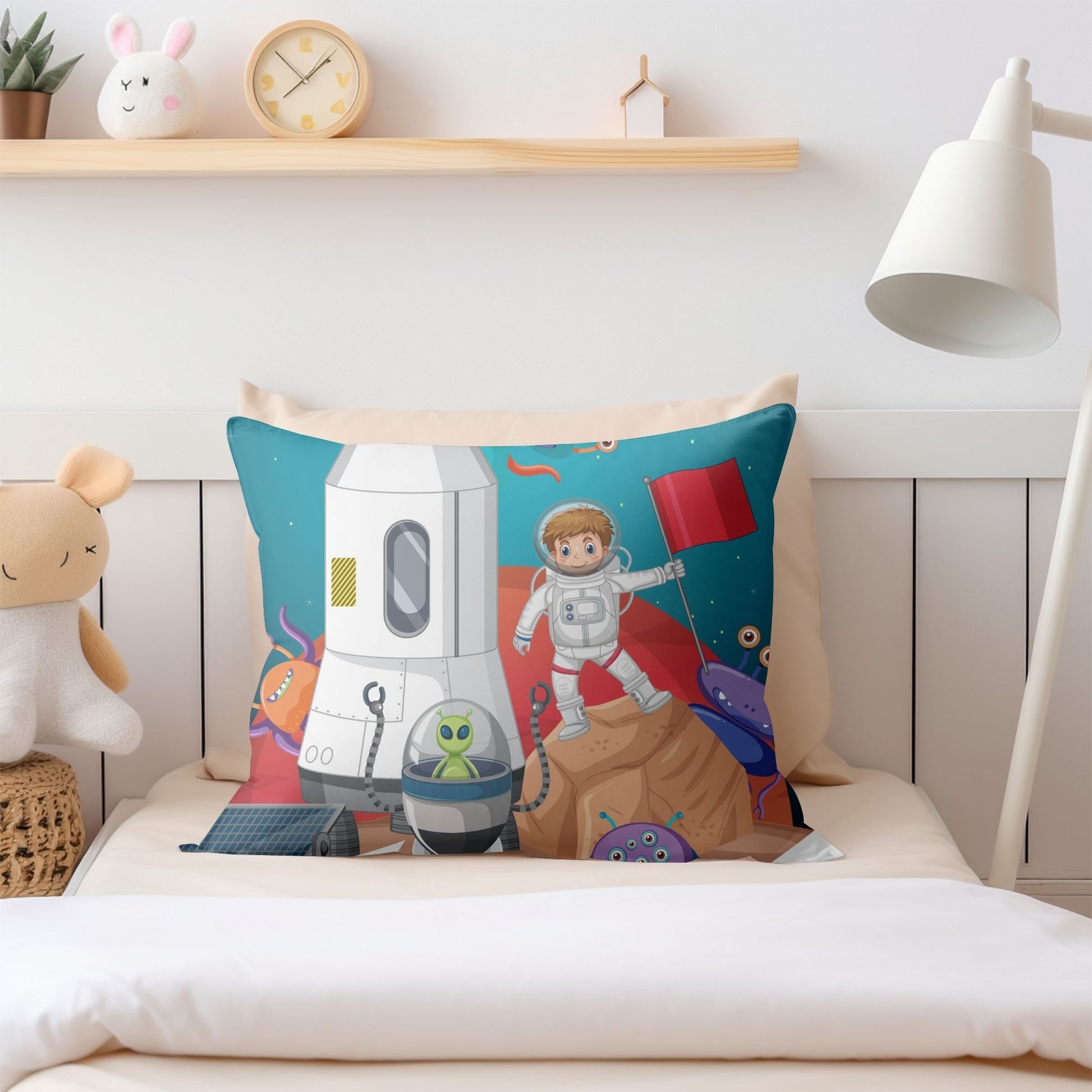 Fun-filled pillow featuring a young space explorer for kids' spaces.
