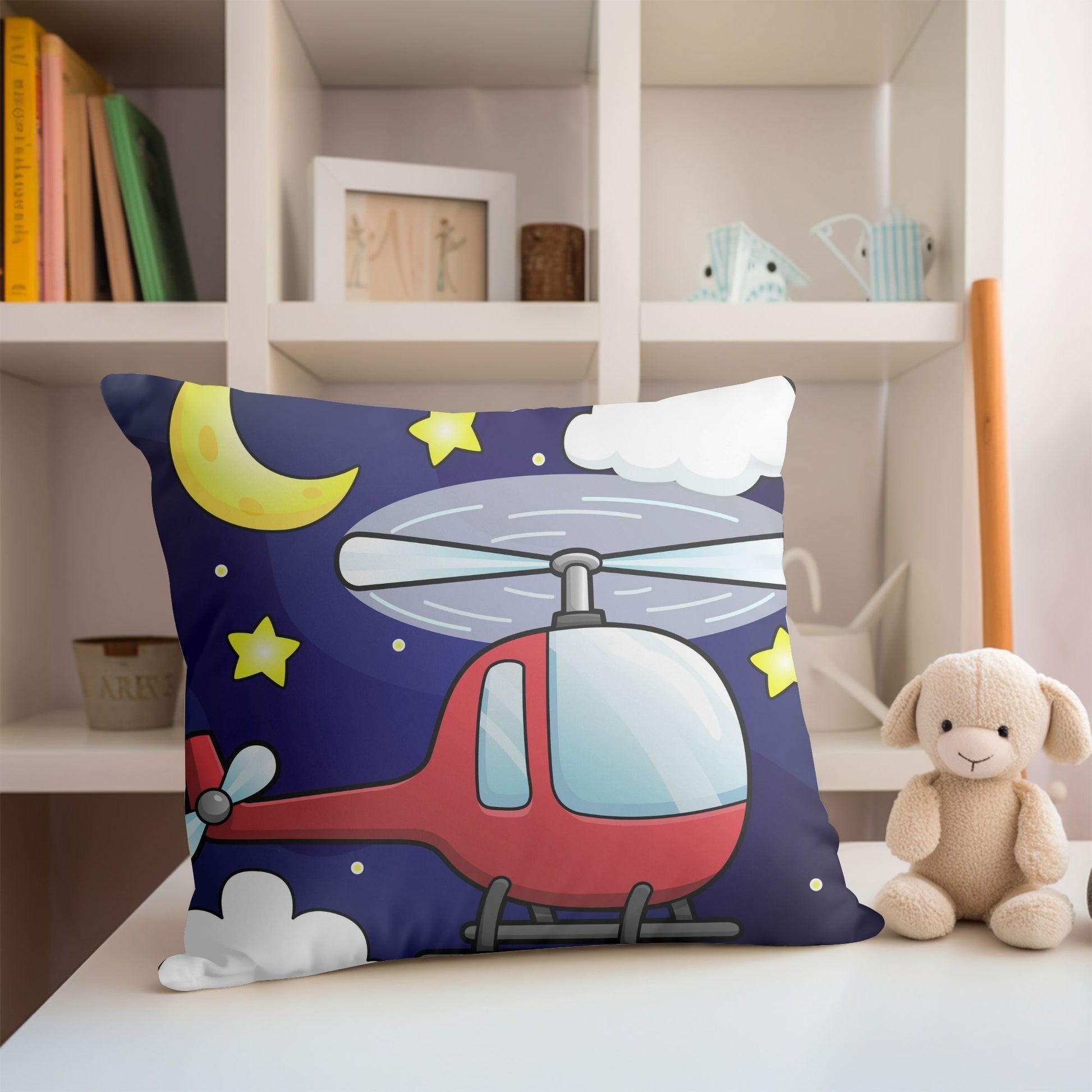 Charming kids pillow adorned with a red helicopter design for aviation enthusiasts.