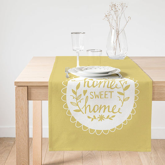Yellow table runner featuring "Home Sweet Home" embroidery for cozy dining.