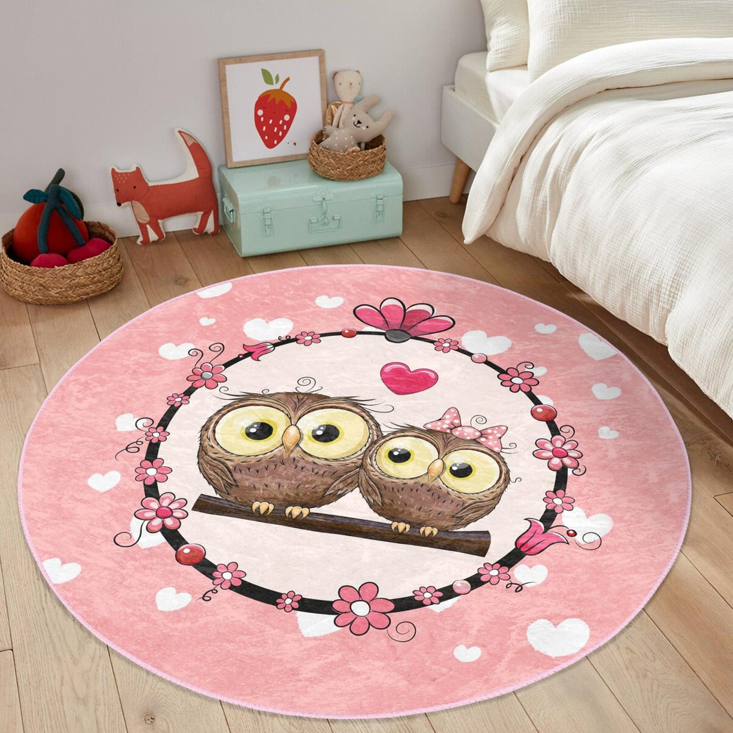 Soft and cozy rug adorned with cute pink owl loves motif for children's rooms.